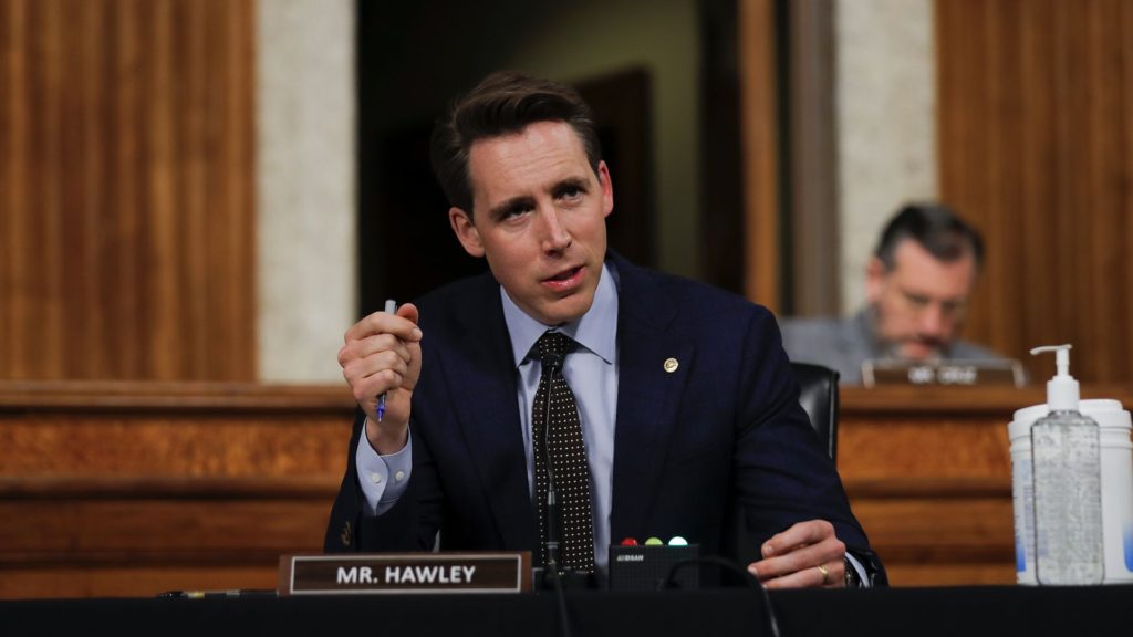 Josh Hawley holding a pen like a penis